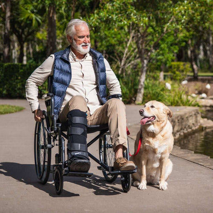 Equipmed 24 inch folding wheelchair with XL wide seat, dark grey steel frame, solid non-puncture wheels, and retractable armrests