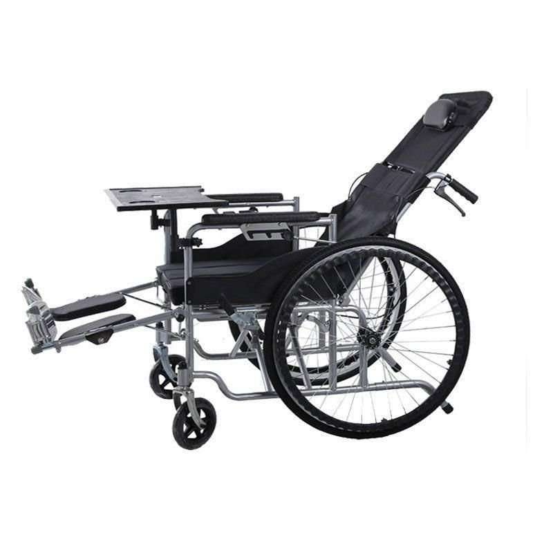 Plastic dining table tray with cup holders and textured surface attached to wheelchair for elderly mobility use