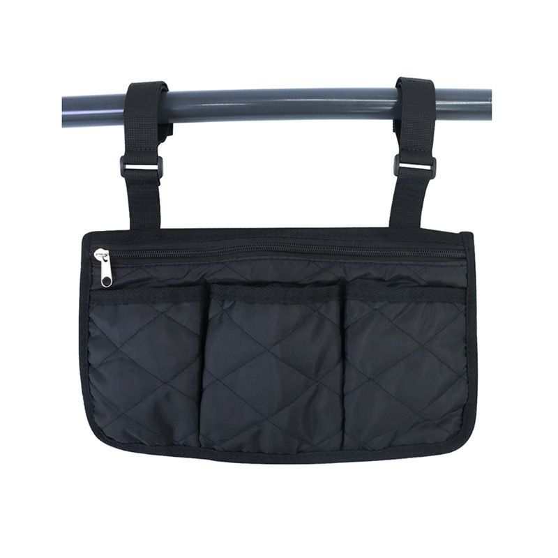 Black wheelchair side bag with 4 pockets hanging on wheelchair armrest